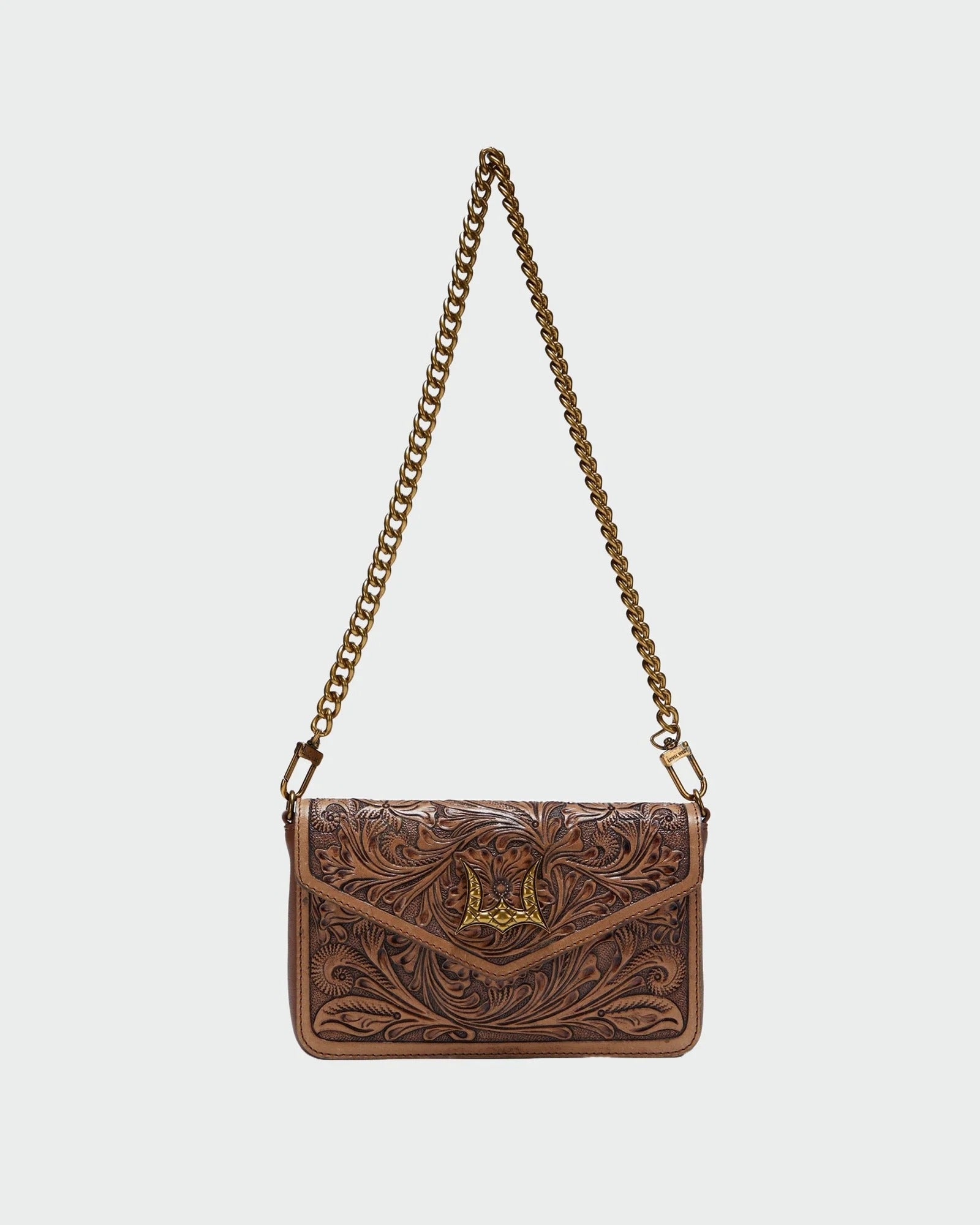 House of Hide handcrafted genuine leather brown shoulder handbag with a stylish gold-tone chain strap displayed on a light gray studio background