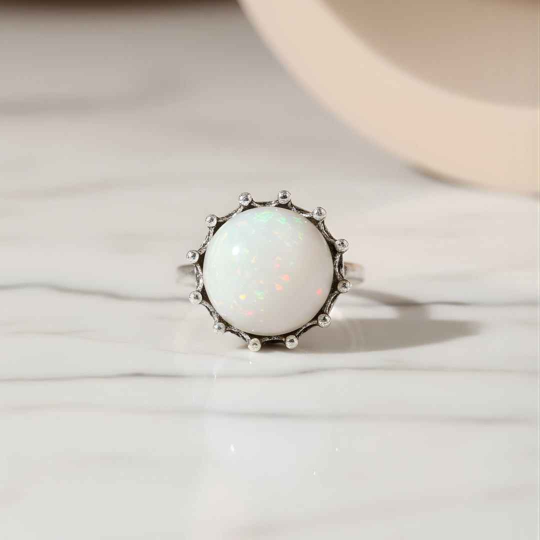 Moonstone Elegance Ring Perth Australia House of Hide with opal stone on beige background