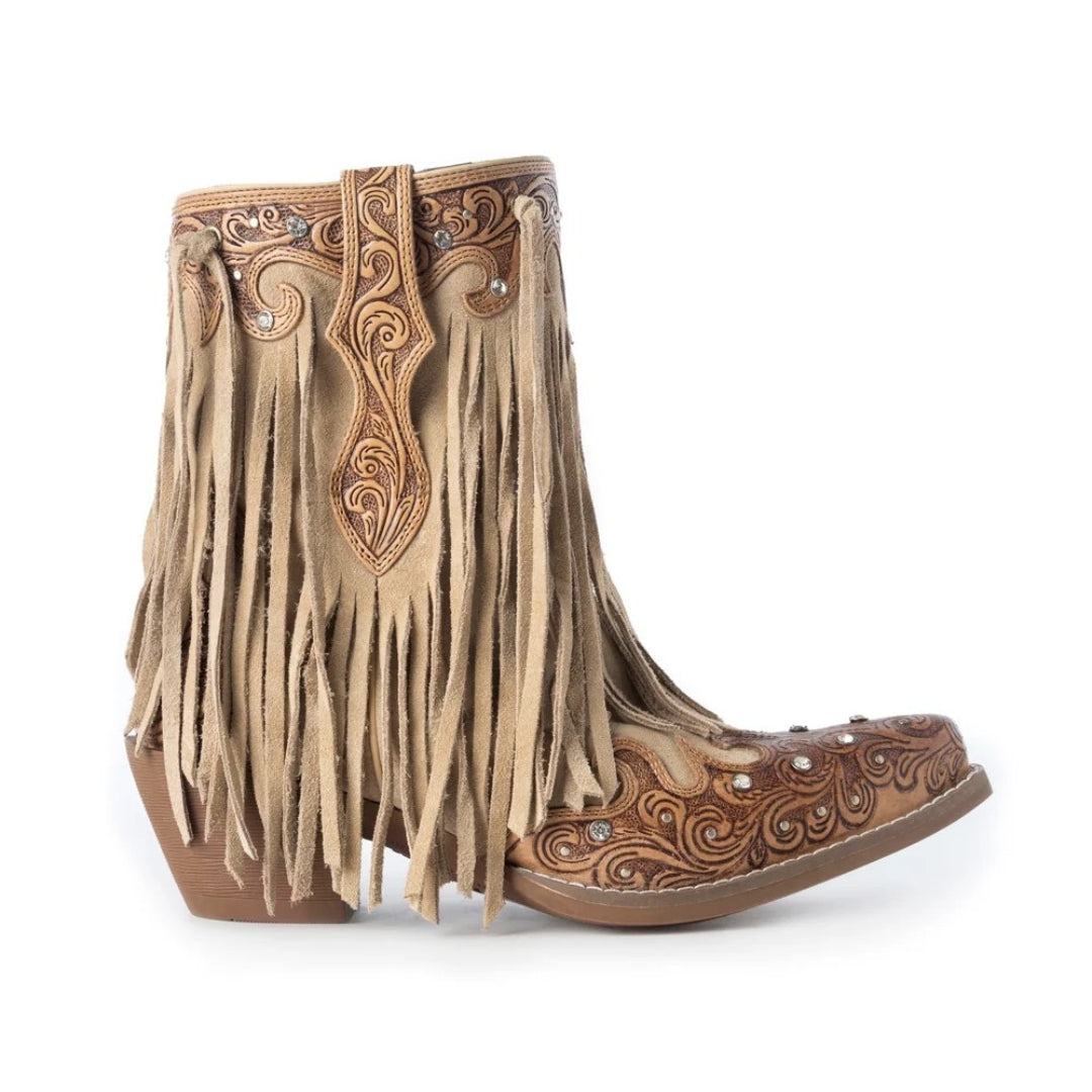 A pair of western-style ankle boots in tan and brown suede with intricate tooled leather detailing, fringe, and small rhinestone embellishments, shown against a plain white background.