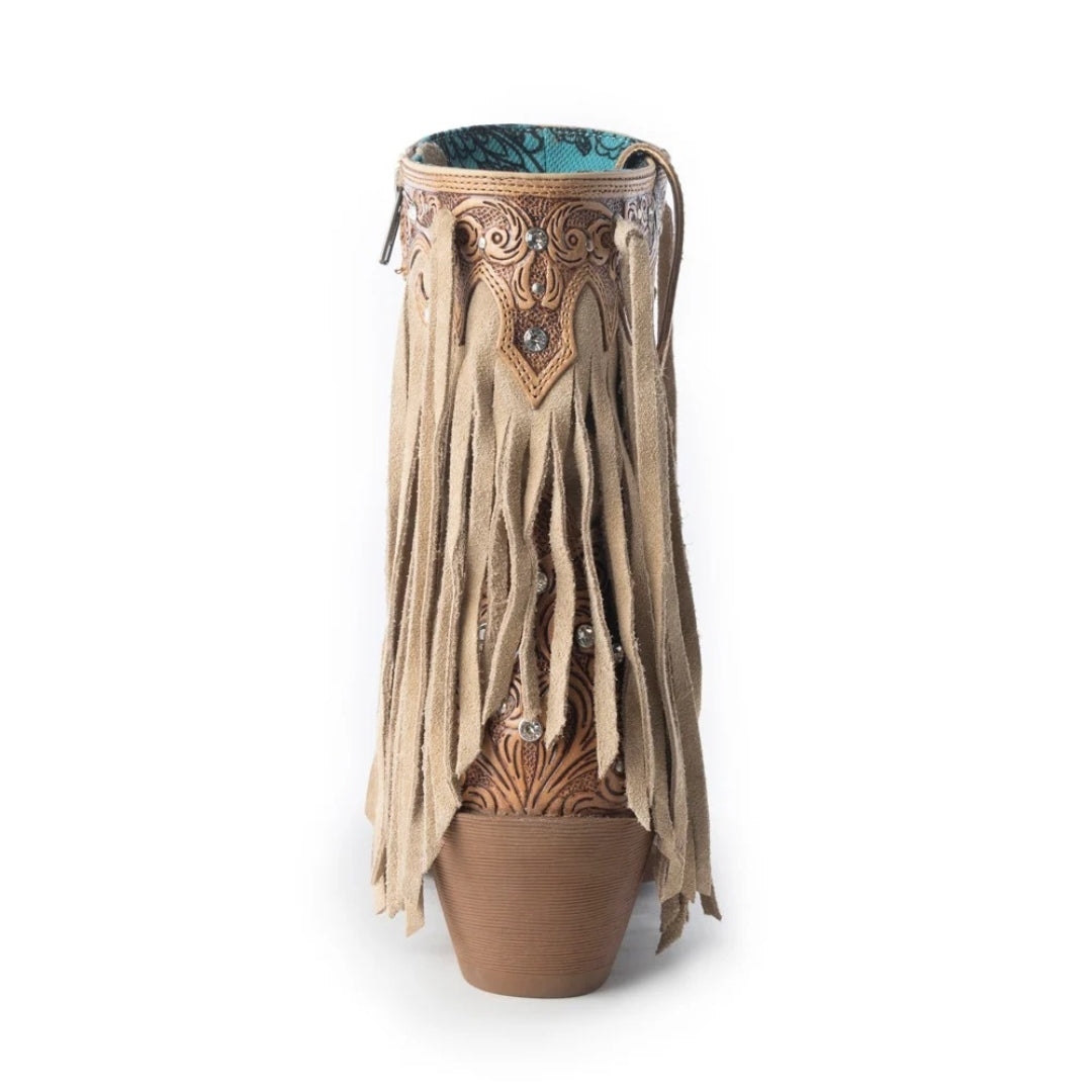 Decorative vase with fringe and intricate design on a white background