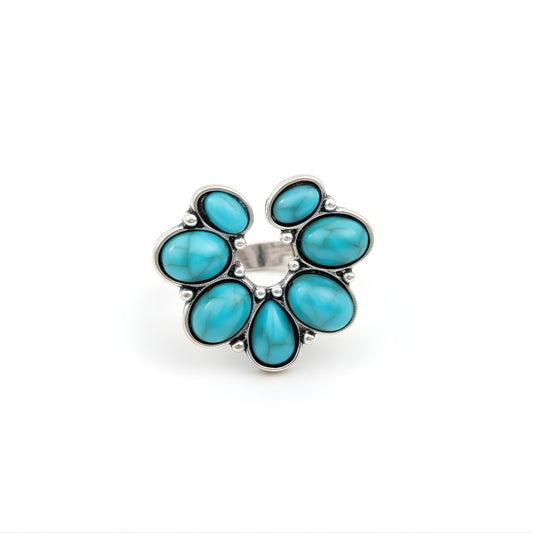 Pacific Bloom Ring Perth Australia House of Hide turquoise stone ring with silver band on light background