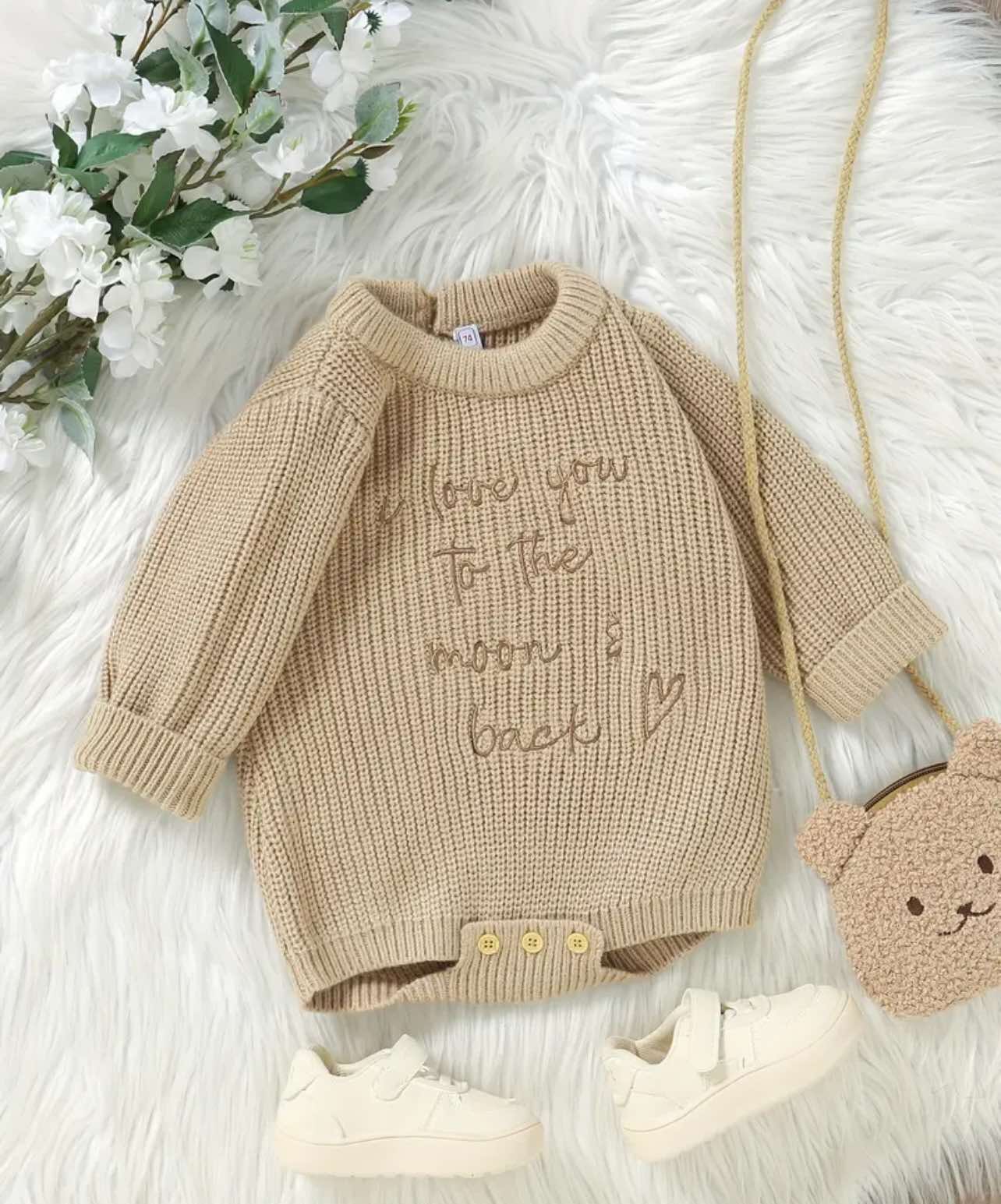 Premium knit baby romper in soft beige with ‘Love You to the Moon & Back’ embroidery, crafted for Australian babies with breathable cotton and an easy-change button closure.
