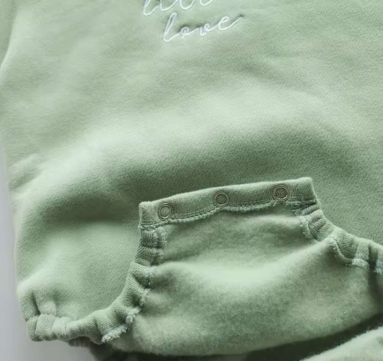 Sage-colored Little Love Bubble Romper with fleece lining and snap buttons, perfect for babies.
