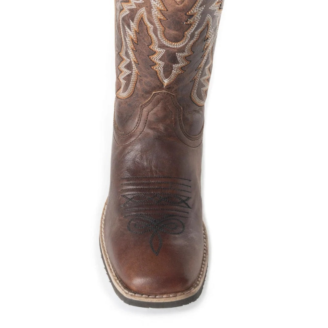 Close-up of the Salvage boot’s brown leather square toe, decorative stitching and contrast sole edging.