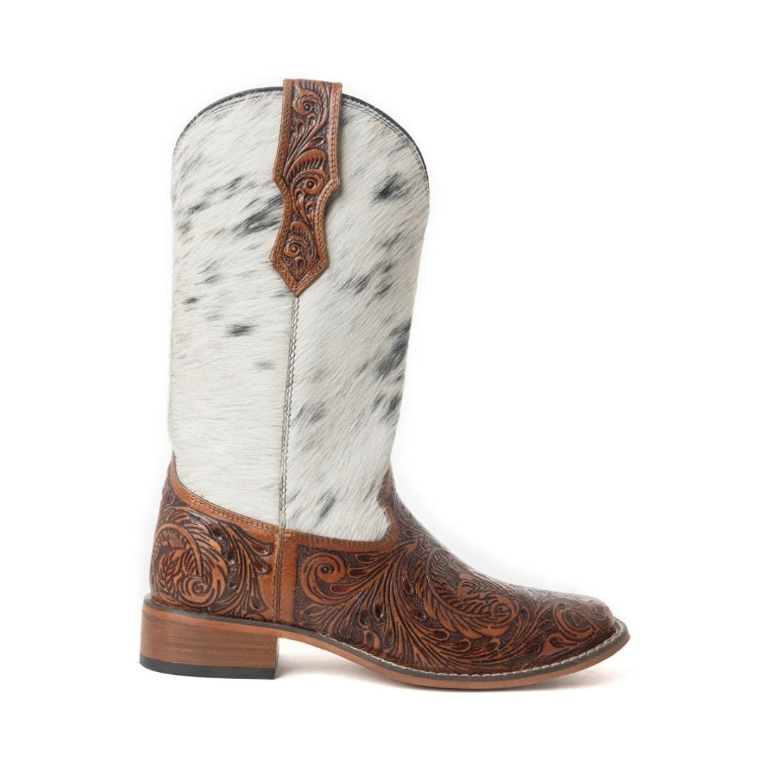 Side view of a Savanna boot showing floral-tooled brown leather, speckled cowhide shaft and low heel.