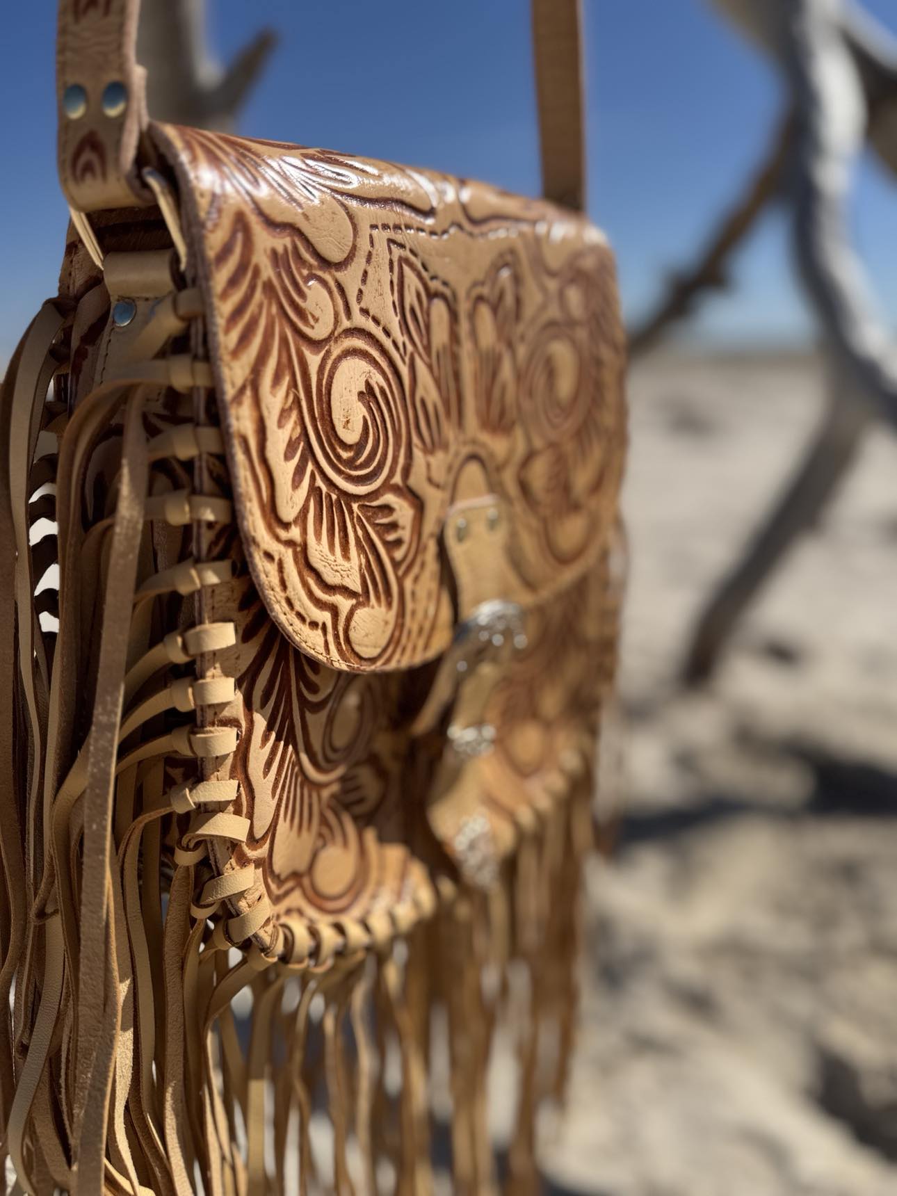 Savannah Western Fringe Bag with hand-tooled floral designs on premium leather flap.