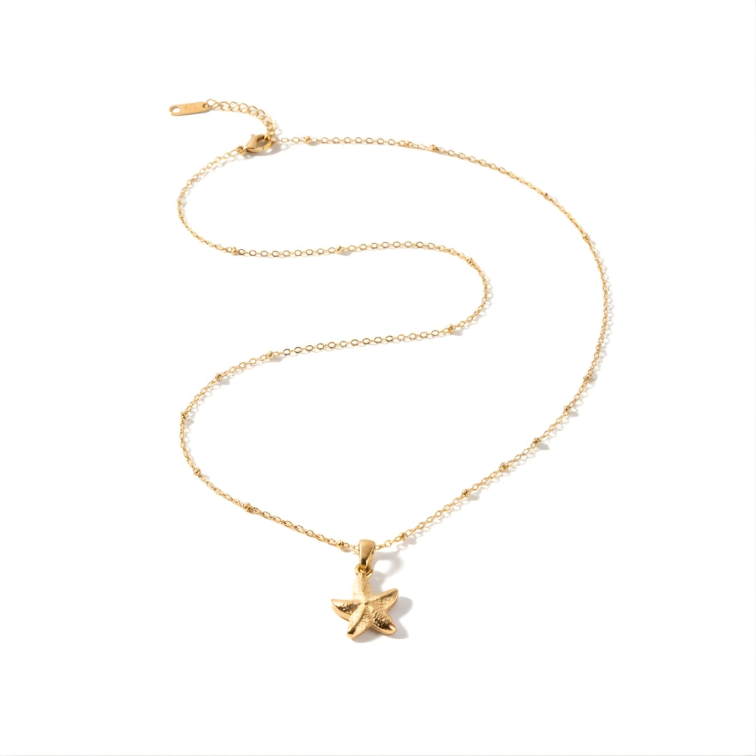 Gold-plated SeaLustre Charm Necklace from House of Hide, capturing coastal charm and sunlit sparkle.