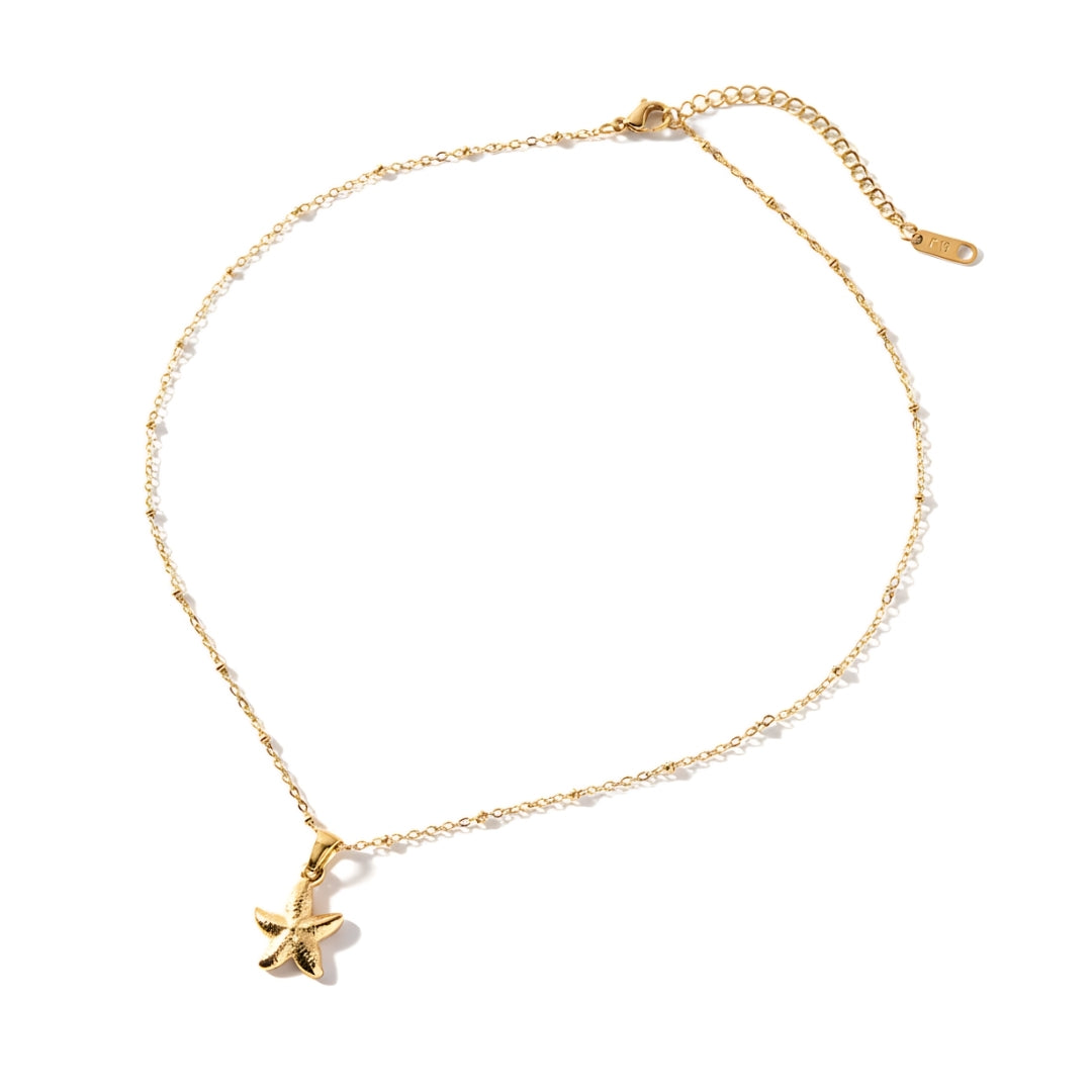 SeaLustre Charm Necklace displayed on soft background, symbolising seaside elegance and tropical sophistication.