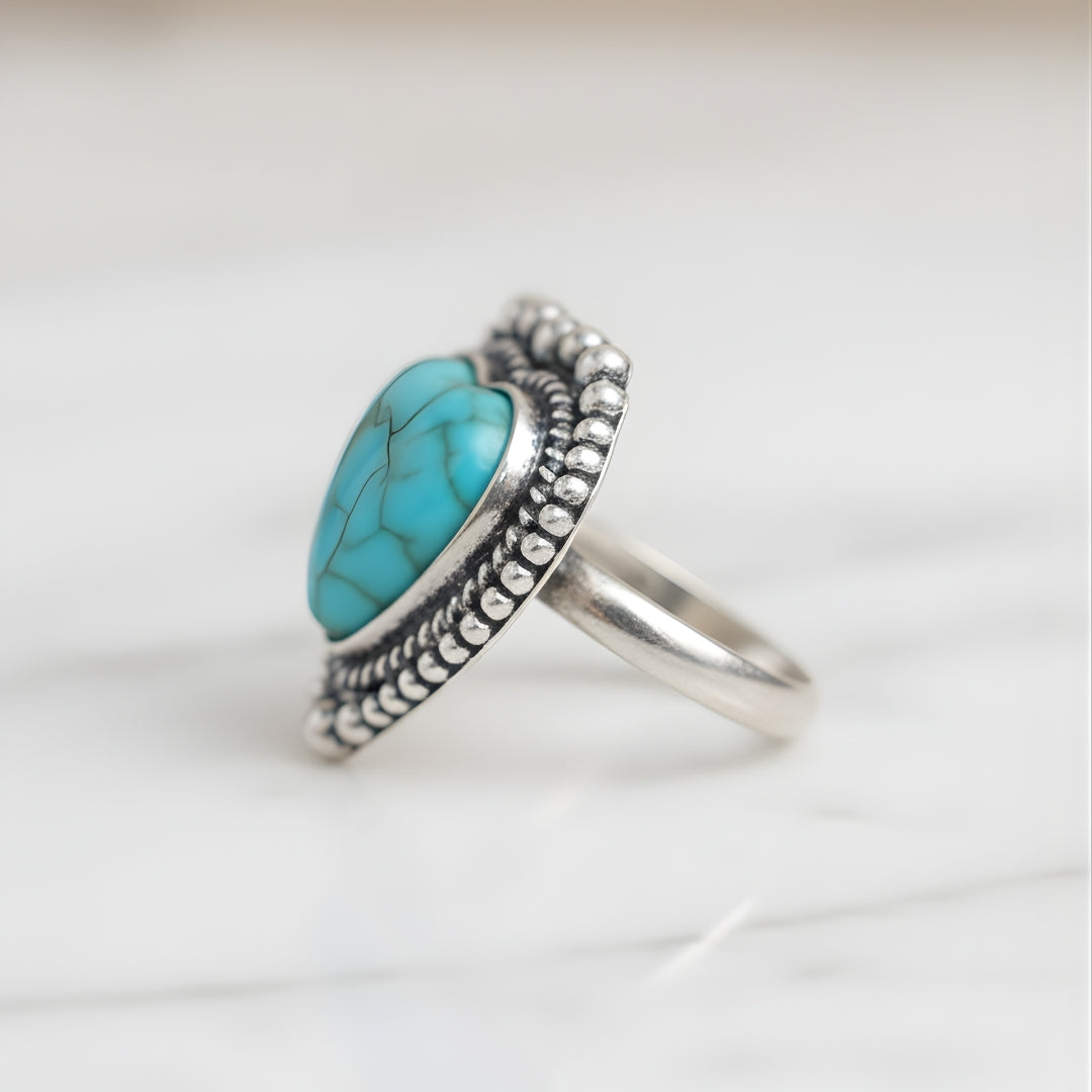 Seabreeze Serenity Ring displayed on white surface elegant turquoise and silver engraved design