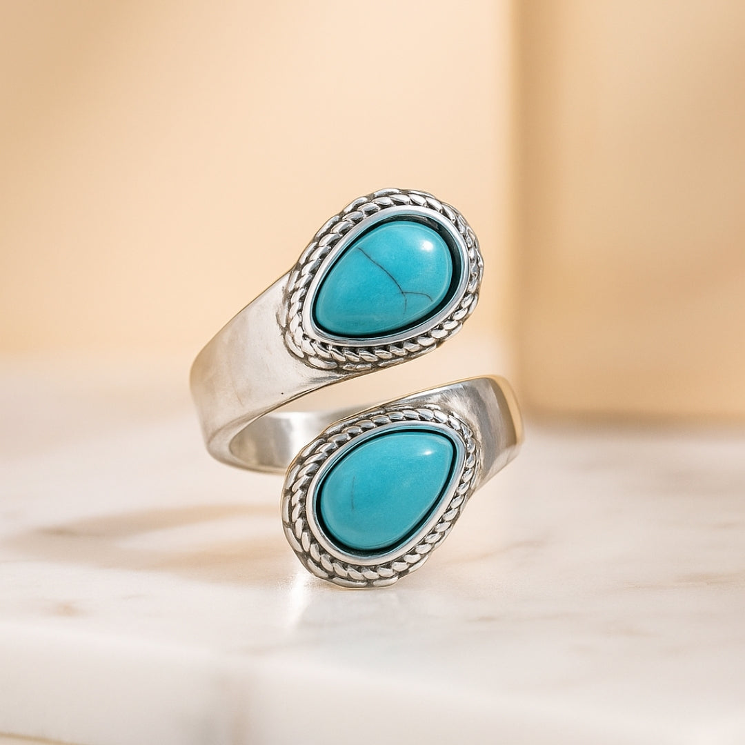 Elegant silver ring with two turquoise teardrop stones Perth House of Hide product photo