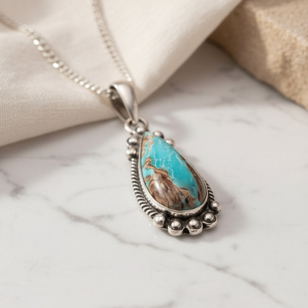 Sierra Sky Necklace displayed on white surface elegant turquoise and silver design