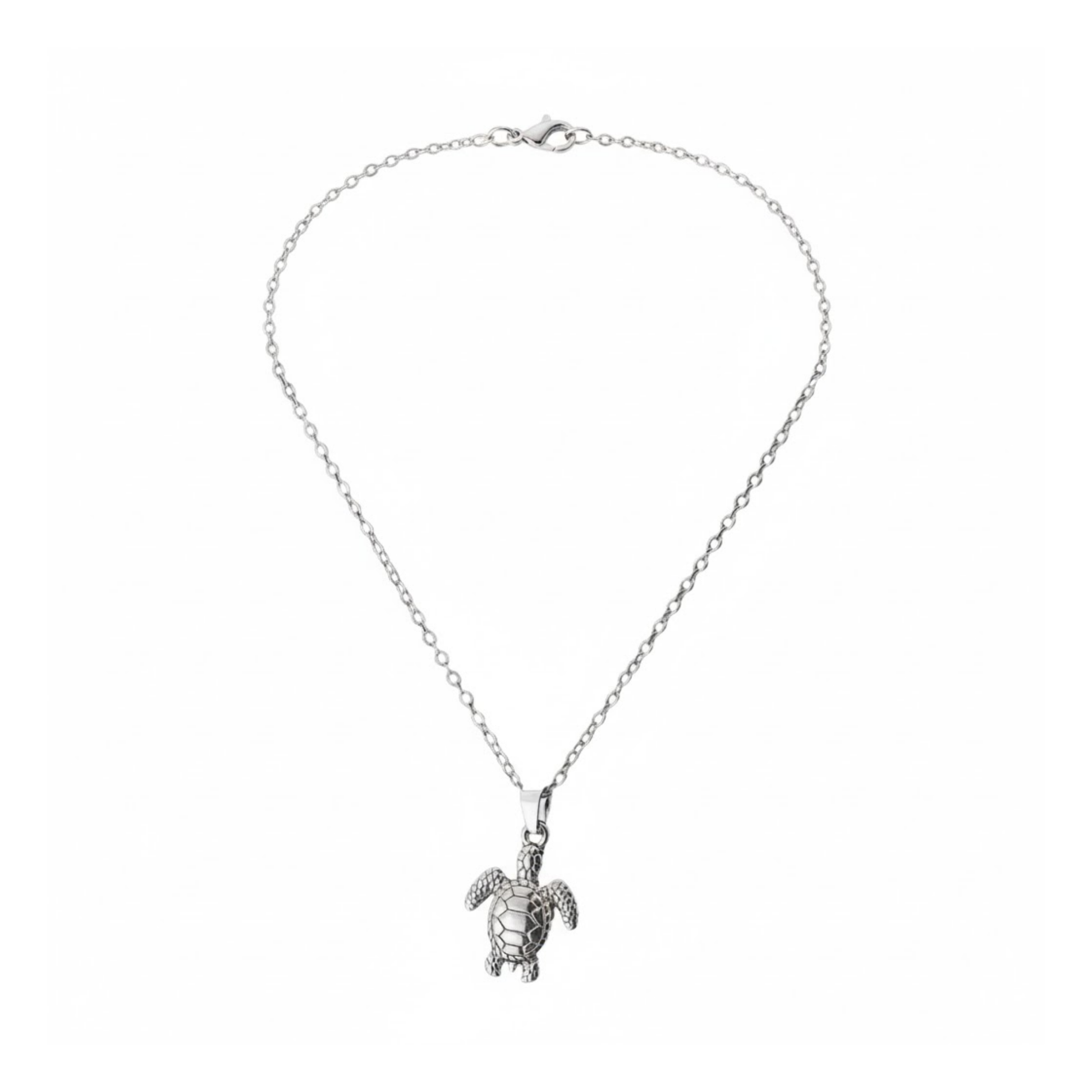 Silver Turtle Necklace Perth Australia Houseofhide jewellery photo showing the turtle charm on reflective surface