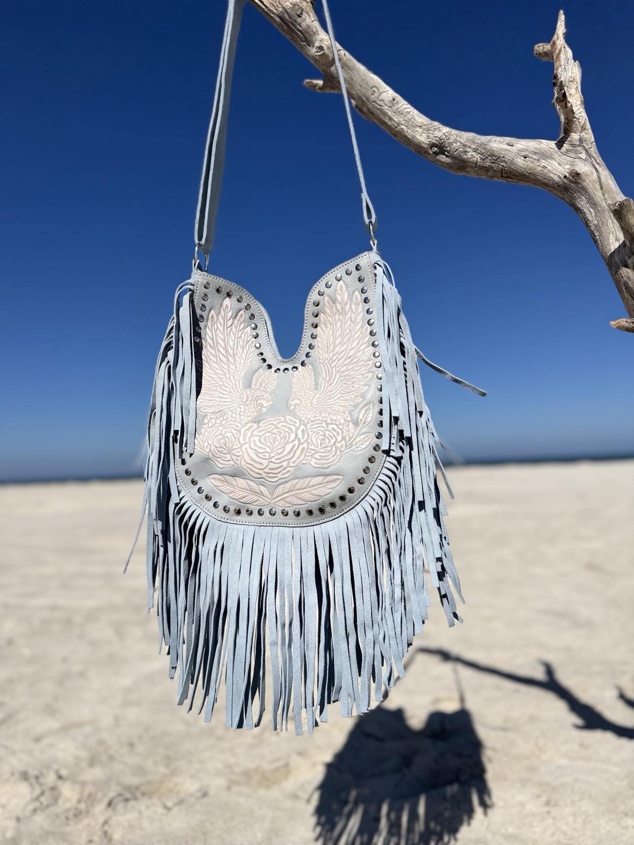 Sky blue leather fringe bag, ideal for summer color analysis and bohemian styling