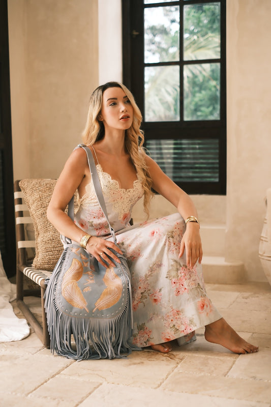 Hand-tooled suede crossbody with feather and bird detailing