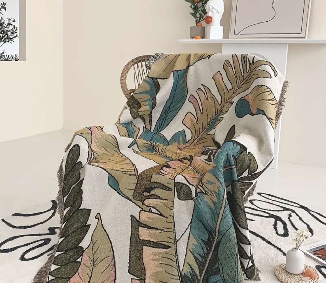 Soft green palm leaf throw blanket for cozy lounging in Australia.
