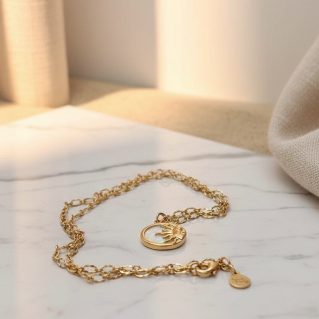 Gold round pendant necklace featuring sun design by House of Hide Perth jewellery