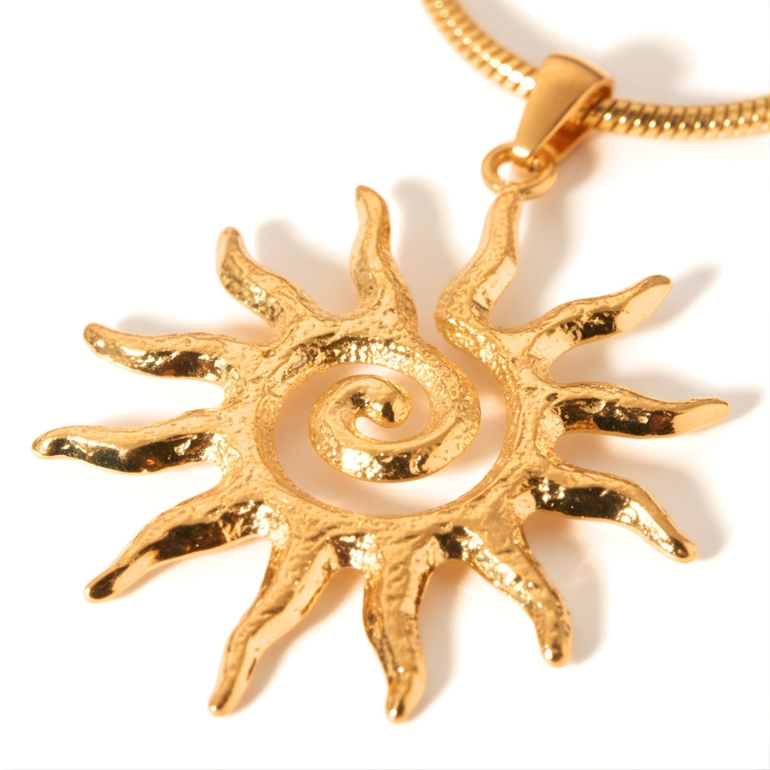 Gold sun pendant necklace by House of Hide Perth displayed on white surface