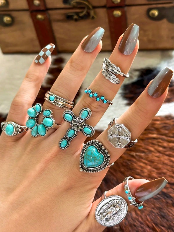 Turquoise ring set Australia, antiqued silver designs with heart stone, floral cross, and bead cluster for rustic desert elegance.