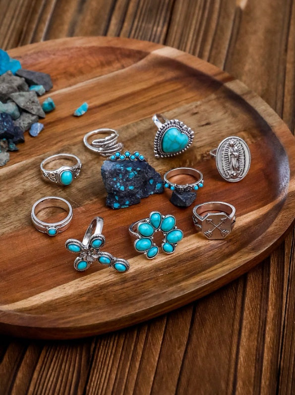 Turquoise ring set Australia, antiqued silver designs with heart stone, floral cross, and bead cluster for rustic desert elegance.
