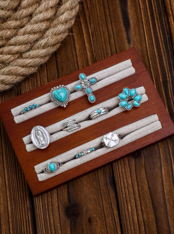 Turquoise ring set Australia, antiqued silver designs with heart stone, floral cross, and bead cluster for rustic desert elegance.