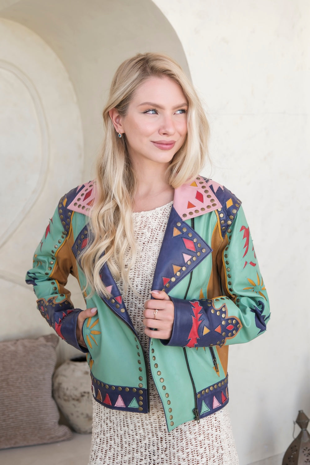 Standout patch leather jacket with sunburst detailing, colourful panels, and gold studs. Handmade statement jacket for modern cowgirls. Free people jacket