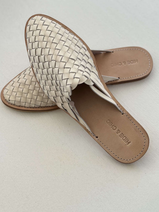 Step into elegance with the Iris Leather Woven Loafer Slide in Bone. Handmade, slim-fit, and crafted with 100% cowhide leather for a perfect Spring and Summer style.