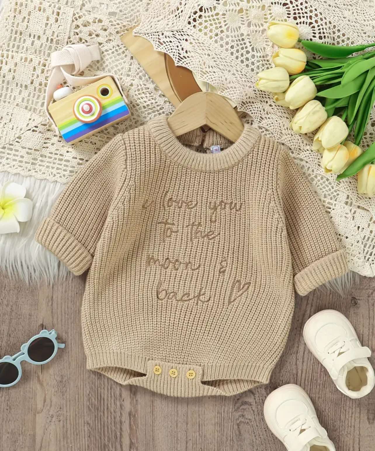 Stylish and practical baby romper in soft knitted fabric, with a heartfelt embroidered message, making it the perfect baby shower gift or newborn outfit for Aussie parents.