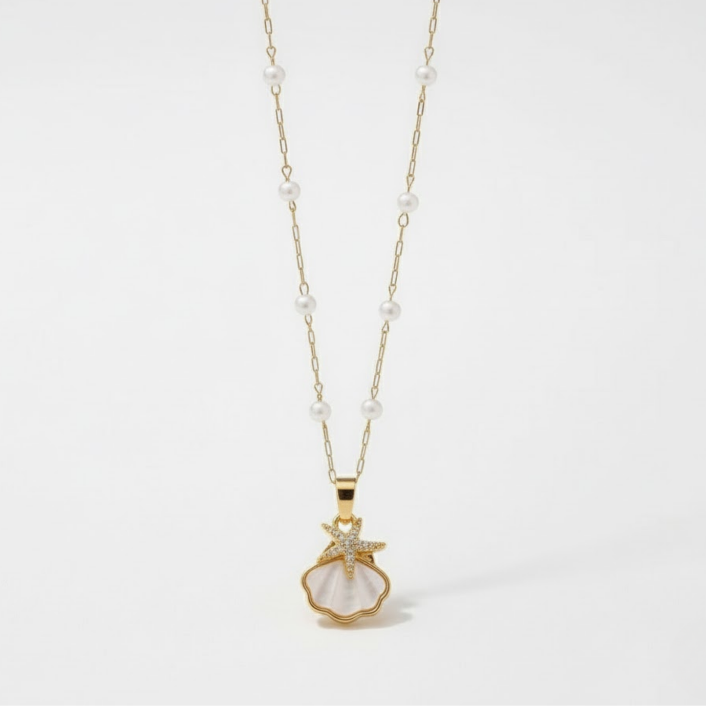 Sunlit Shell Necklace Australia Houseofhide featuring a white shell pendant on a gold-tone stainless steel chain.
