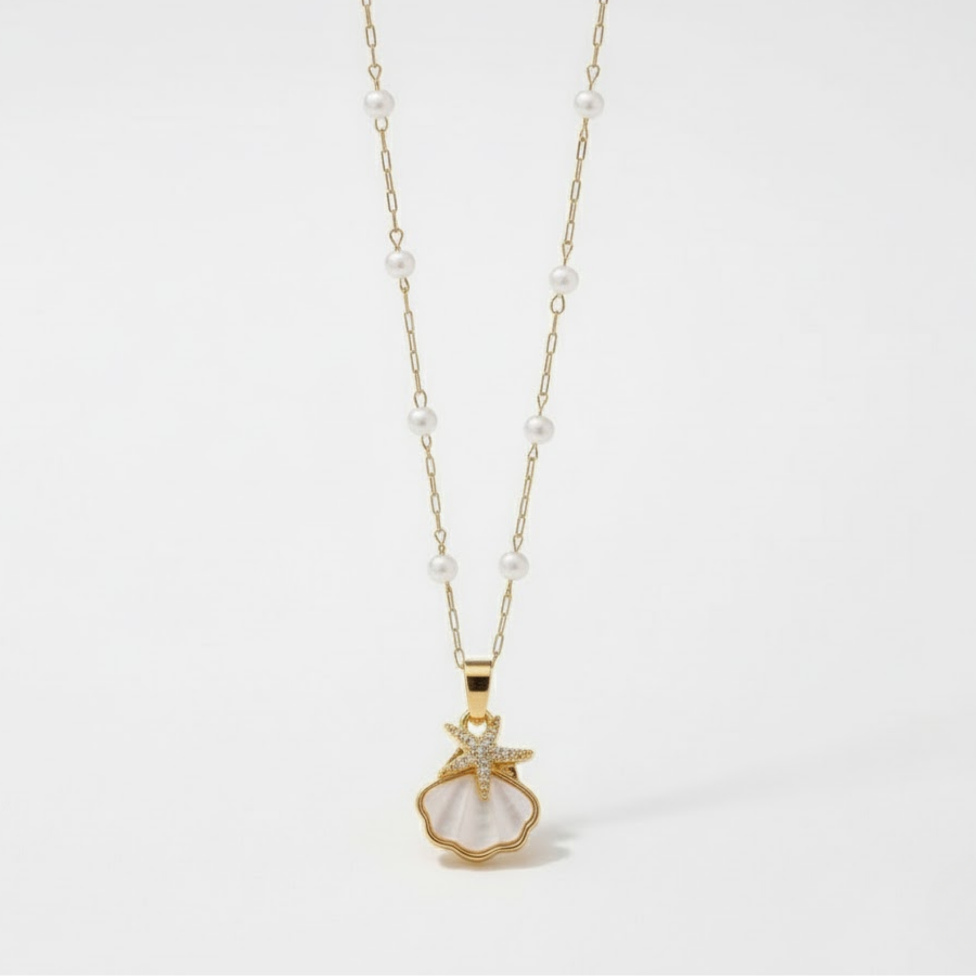 Sunlit Shell Necklace Australia Houseofhide featuring a white shell pendant on a gold-tone stainless steel chain.