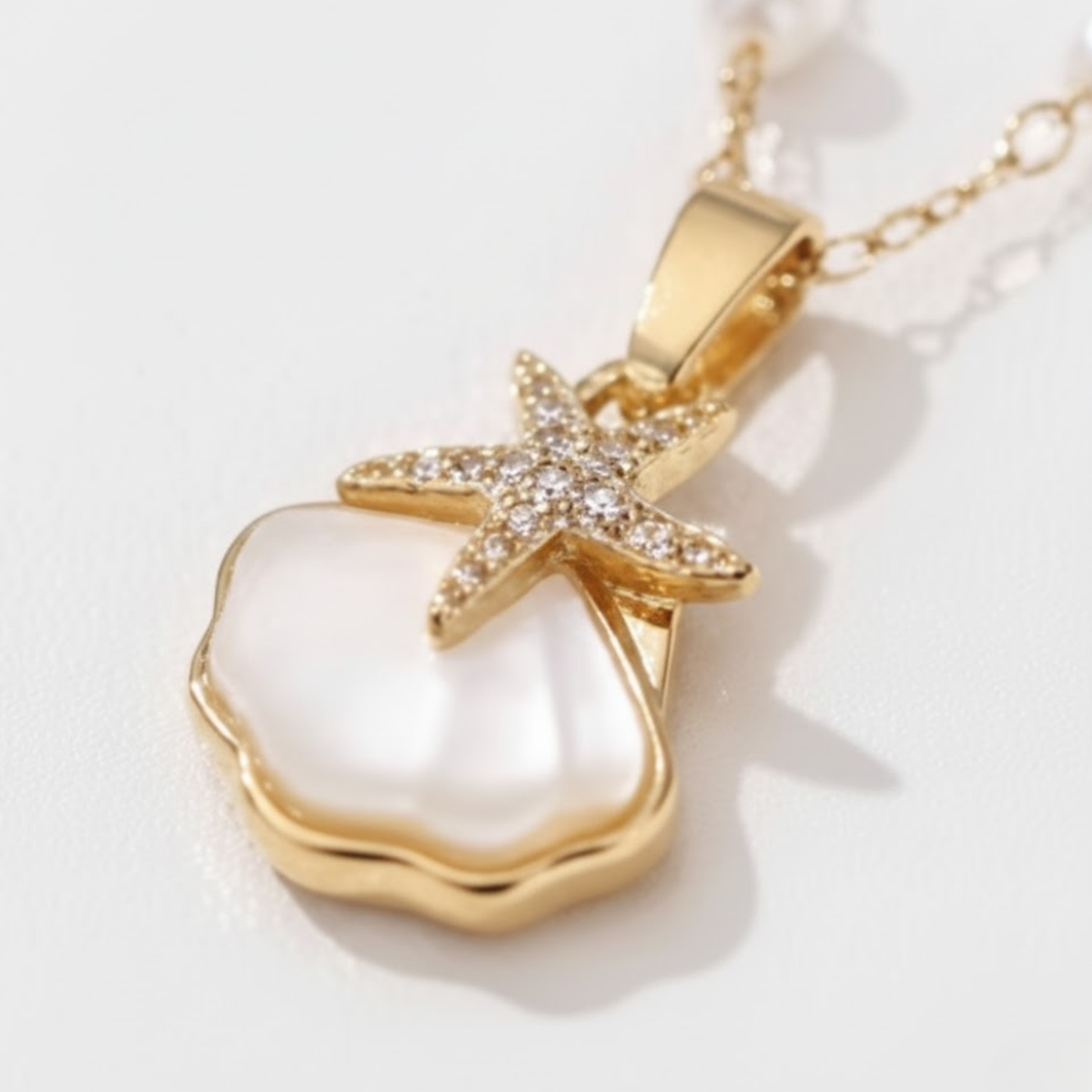 Elegant Sunlit Shell Necklace Australia Houseofhide displayed on a reflective surface highlighting its tropical-inspired design.