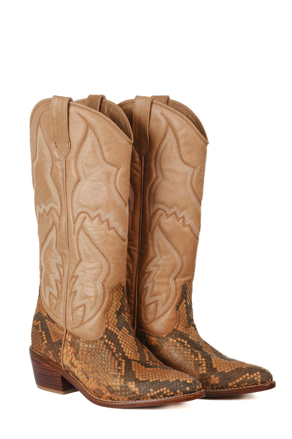 Tan leather cowboy boots with snakeskin textured foot and subtle western stitching detail