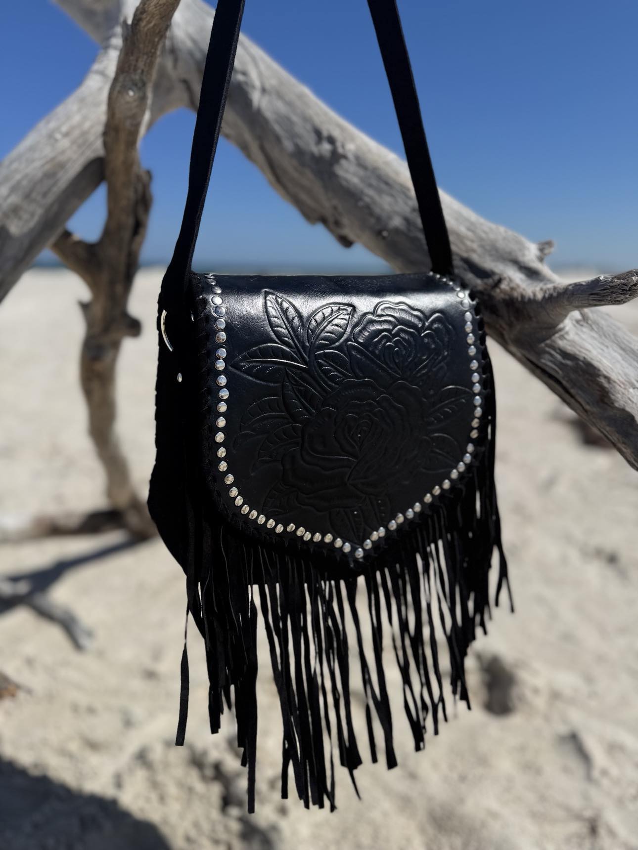 This boho fringe bag captures western style with vintage charm. Perfect for a boho-chic look, designed and crafted in Perth by House of Hide.