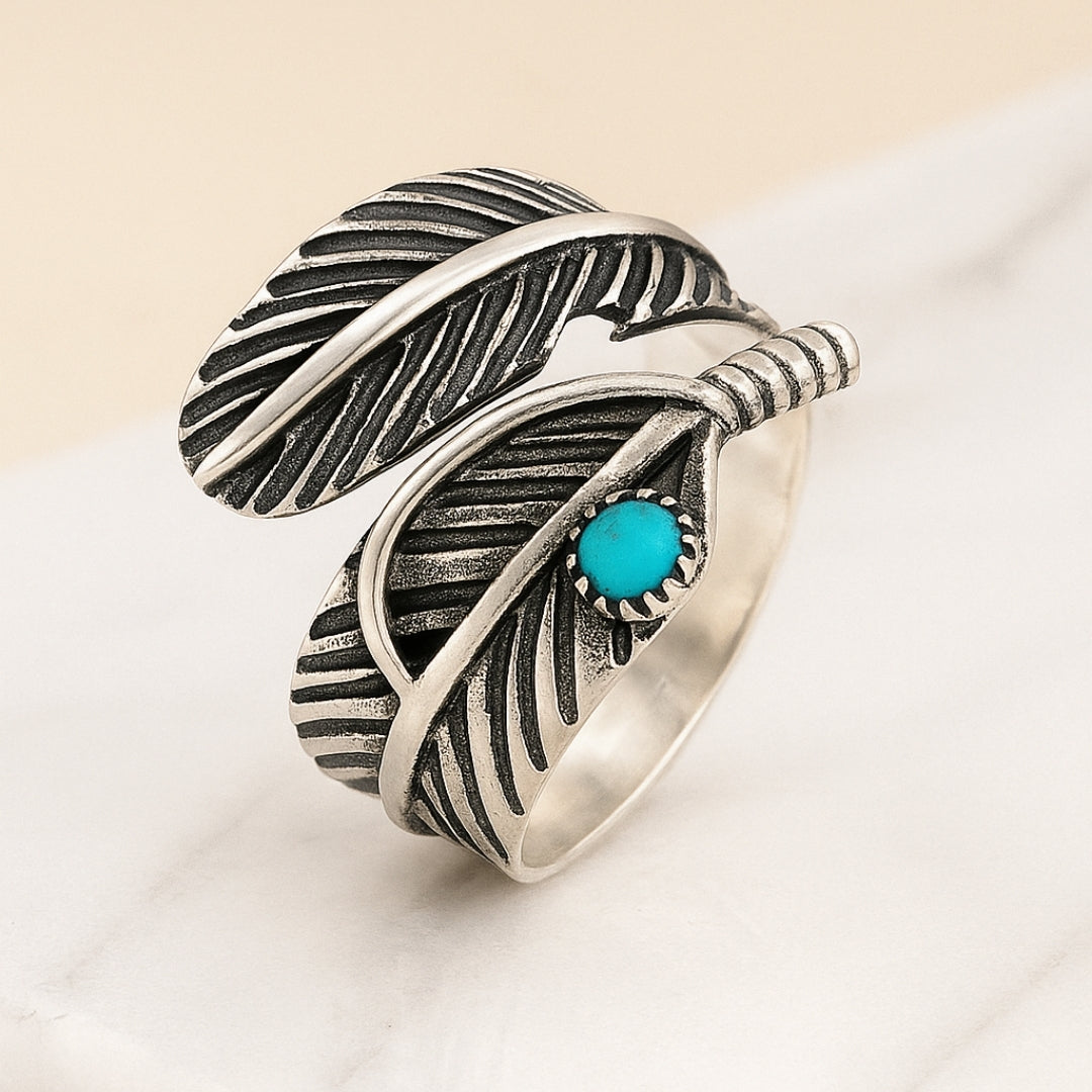 Elegant silver ring with turquoise stone and feather detailing House of Hide Perth product photo
