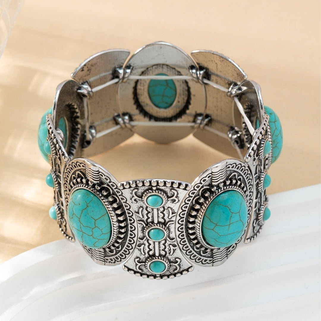 Turquoise Tide Bracelet displayed on white surface artisan silver and turquoise stone design