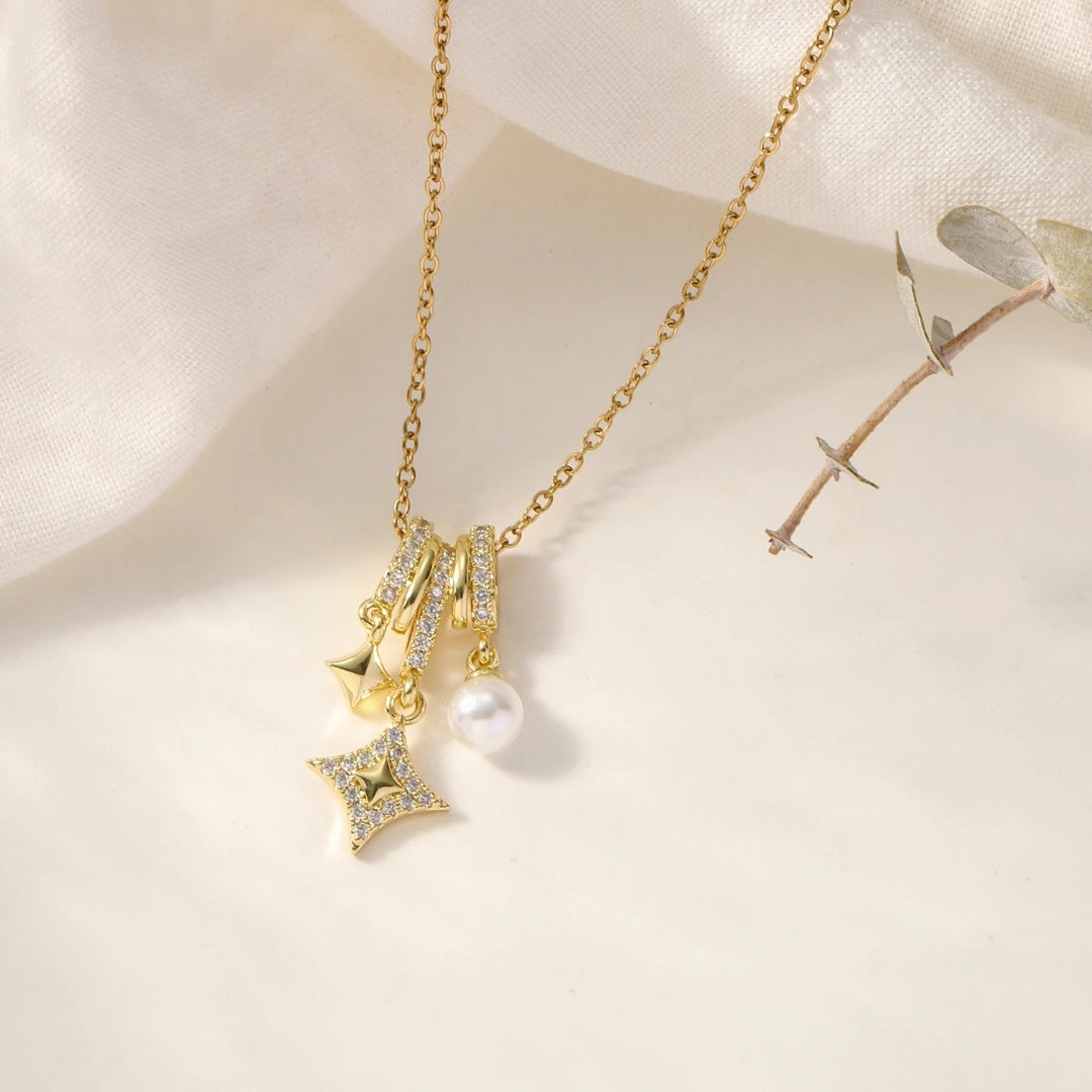 Twilight Sparkle gold necklace displayed on white surface elegant star and pearl design