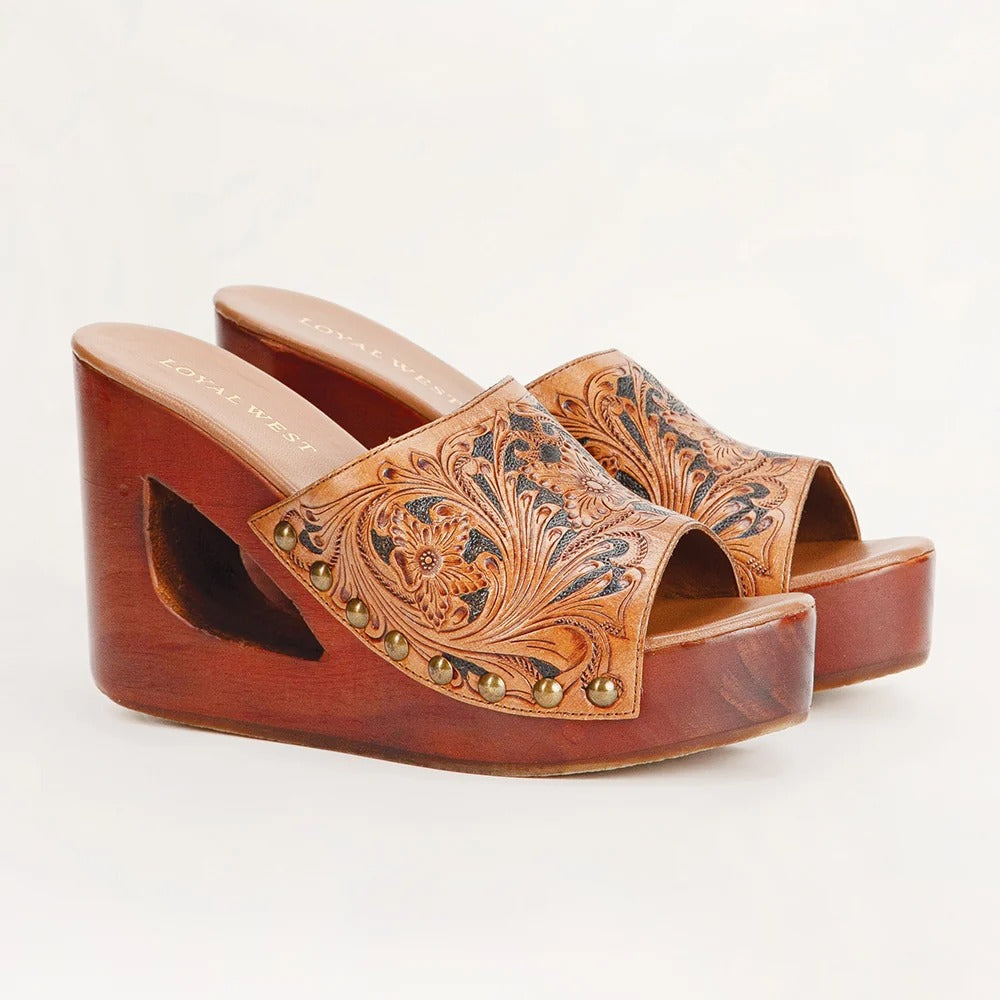 House of Hide handcrafted genuine leather brown wedge sandals with detailed carved designs and a western-inspired style on a white background