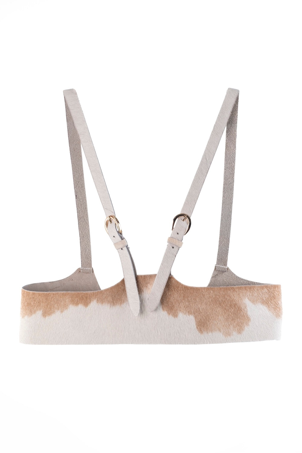 Western-style cowhide harness with polished buckles and artisan design.