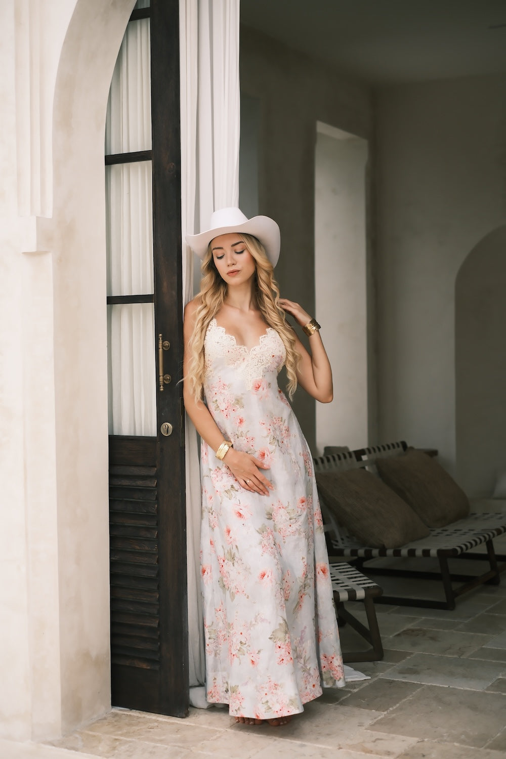 Western-style white oat cowboy hat with wide curled brim