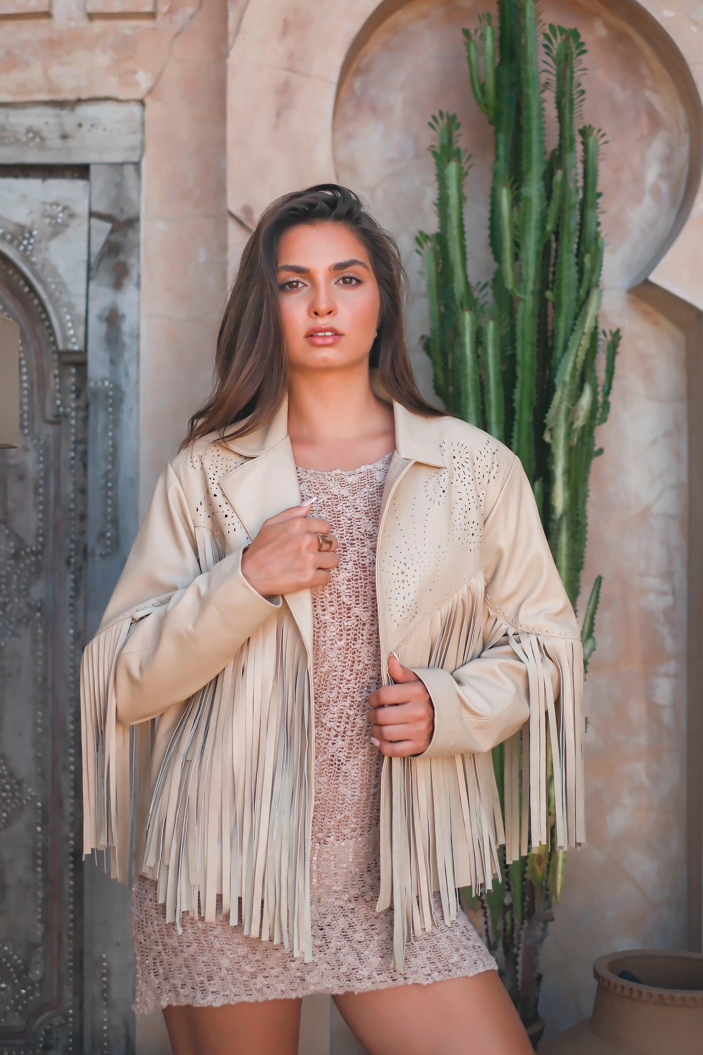 White leather jacket with fringe and structured collar, perfect for festival or country styling