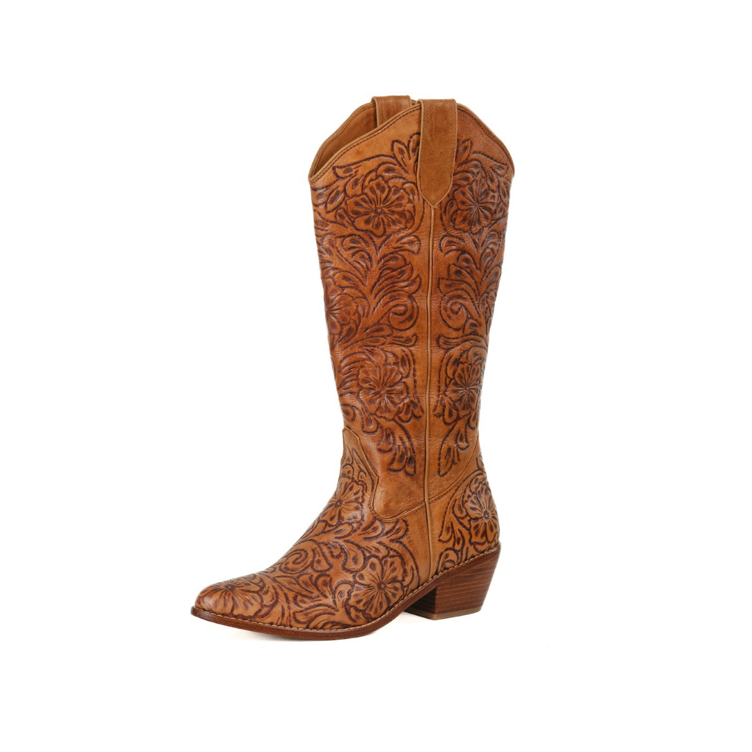 A single knee-high western boot in warm tan leather with intricate dark brown floral tooling, shown from a side profile on a plain white background.
