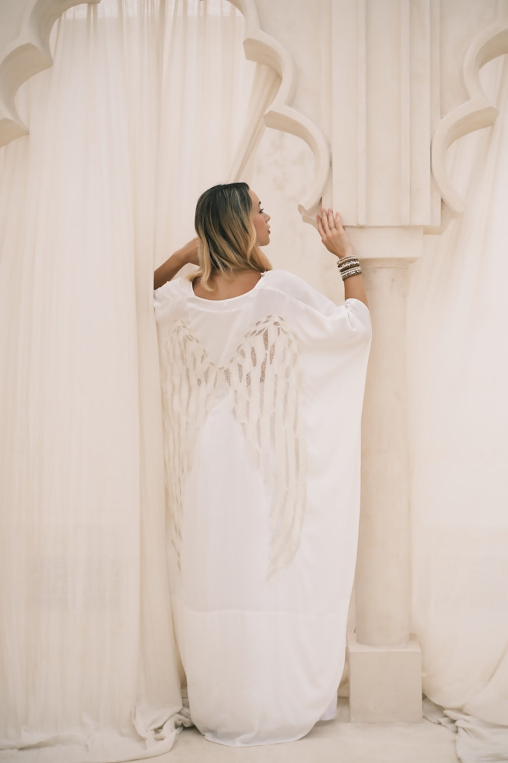 Women’s boho kimono in soft white with apricot accents, casual summer outfit