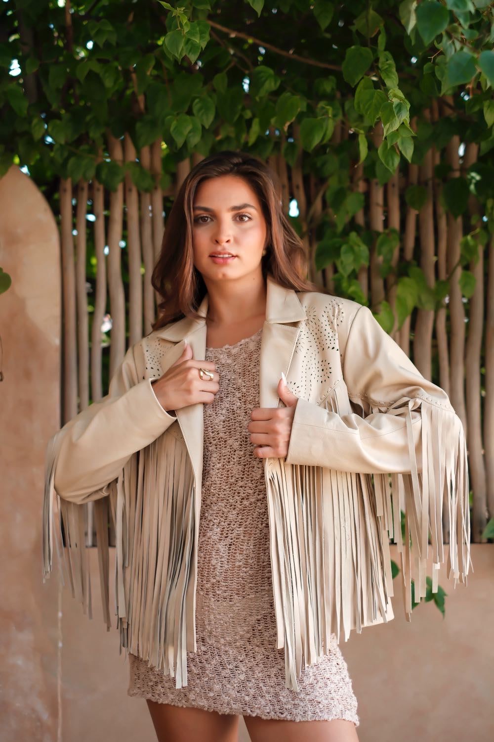 Women's cream fringe leather jacket with laser cut detailing and western style