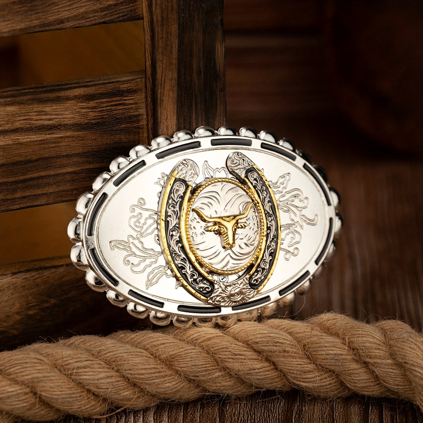 Belt buckle with horse head design on a wooden background