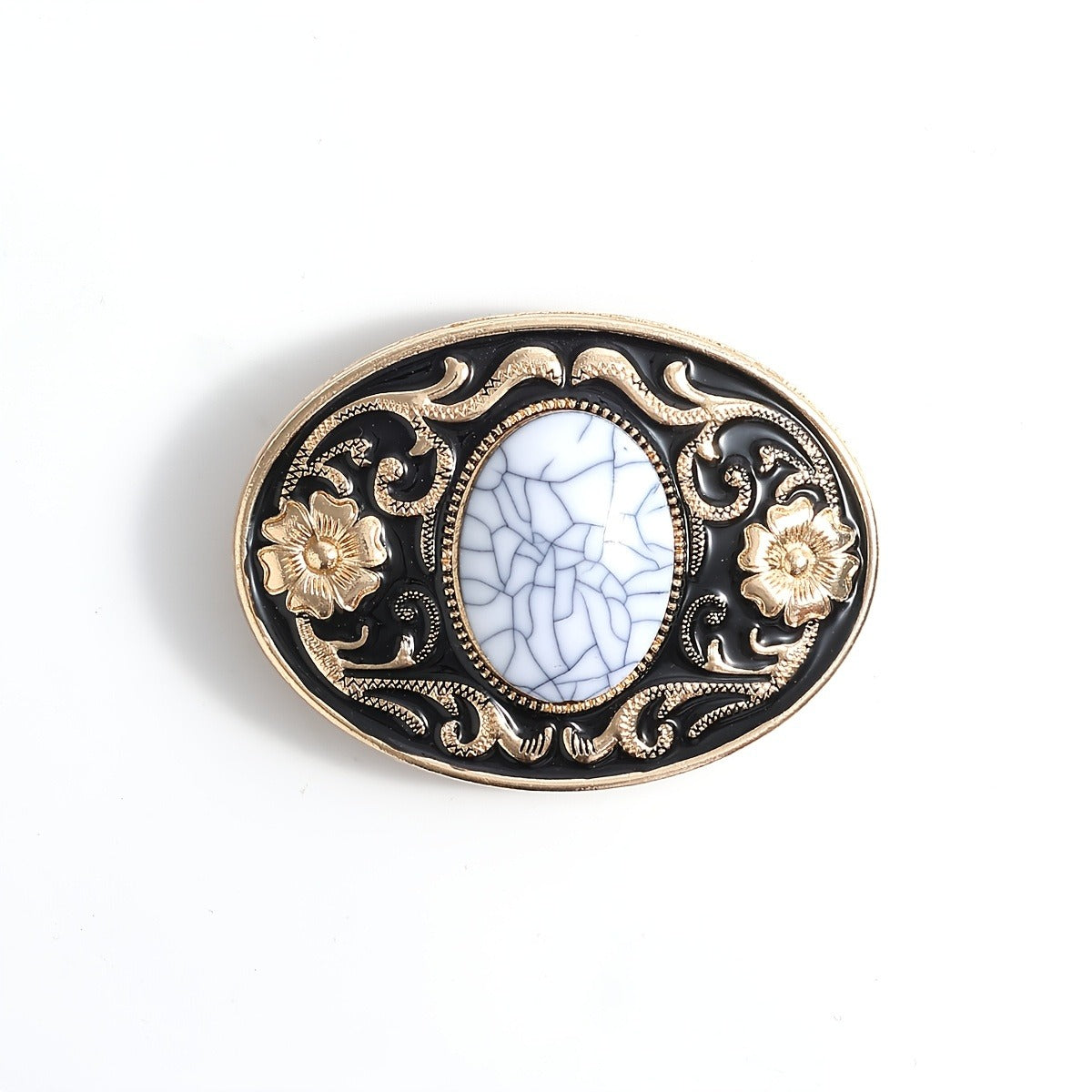 Belt buckle with a golden black color and a floral design and white cracked-design gemstone in the middle on a white background