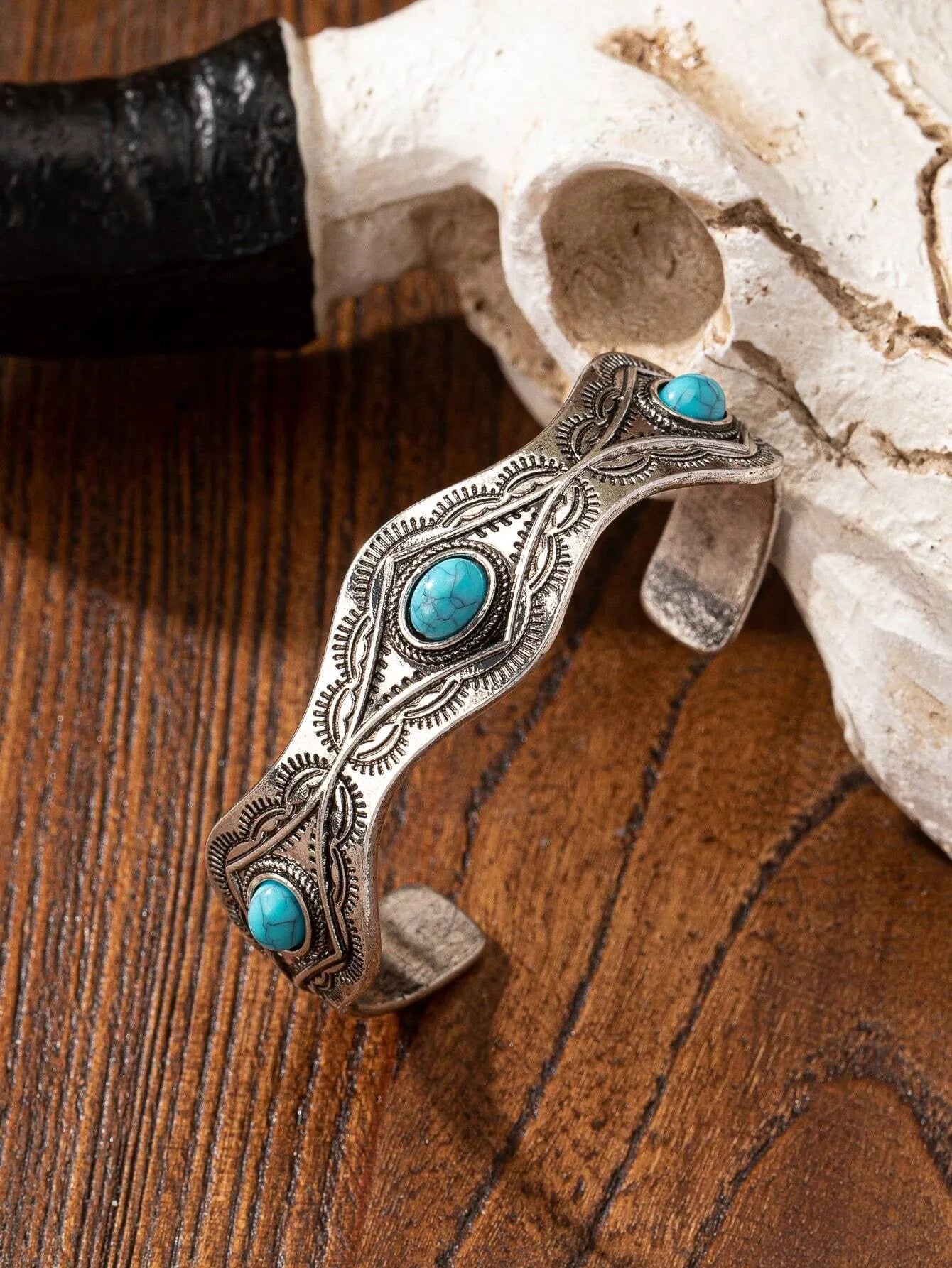 Blue turquoise acrylic decor bracelet view on a wooden surface 