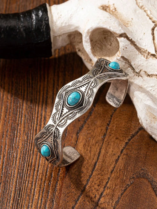 Blue turquoise acrylic decor bracelet view on a wooden surface 