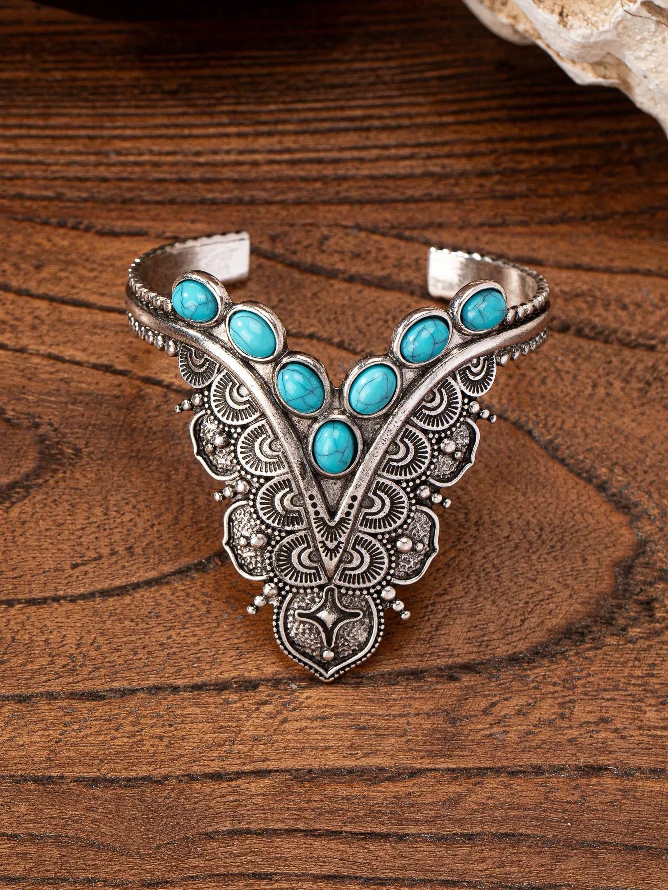 Blue turquoise mesa bracelet on a wooden surface