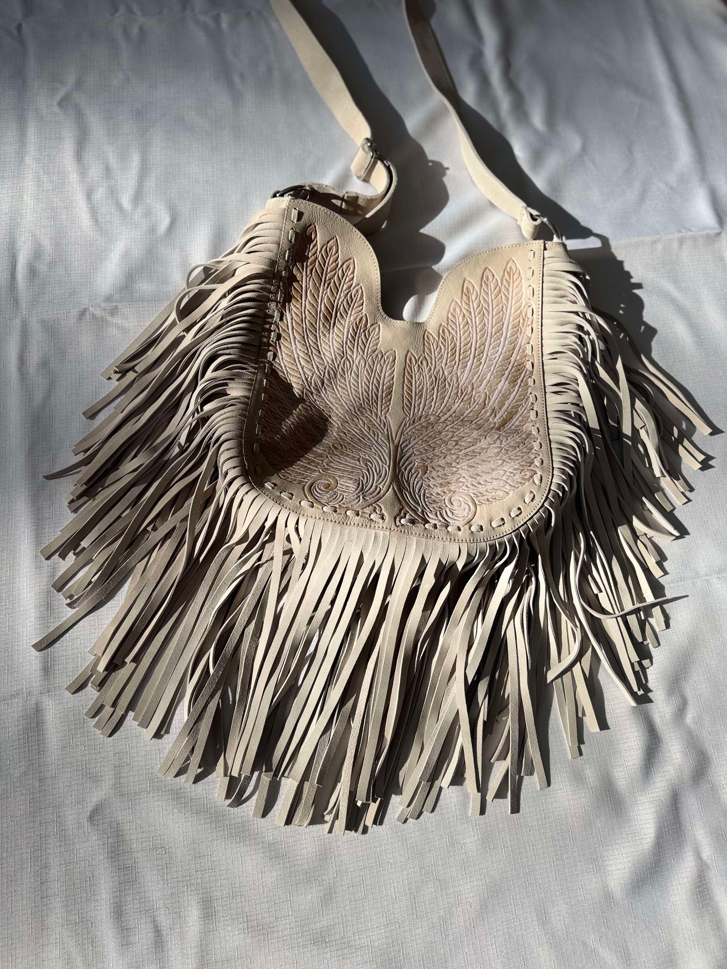 Handcrafted cream and blush boho leather bag with fringe and western details