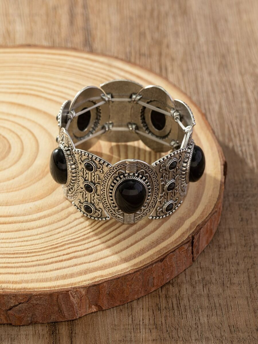 Bohemian western silver cuff bracelet closeup view, black onyx statement jewelry, vintage wide link bracelet.