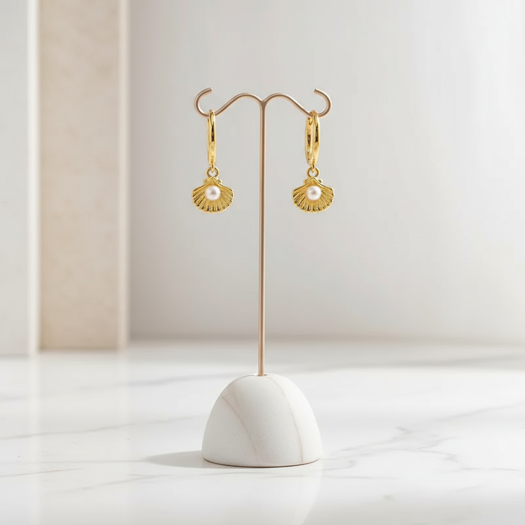 Lightweight gold hoop earrings featuring radiant seashell and pearl-like zircon – coastal design by Houseofhide Australia